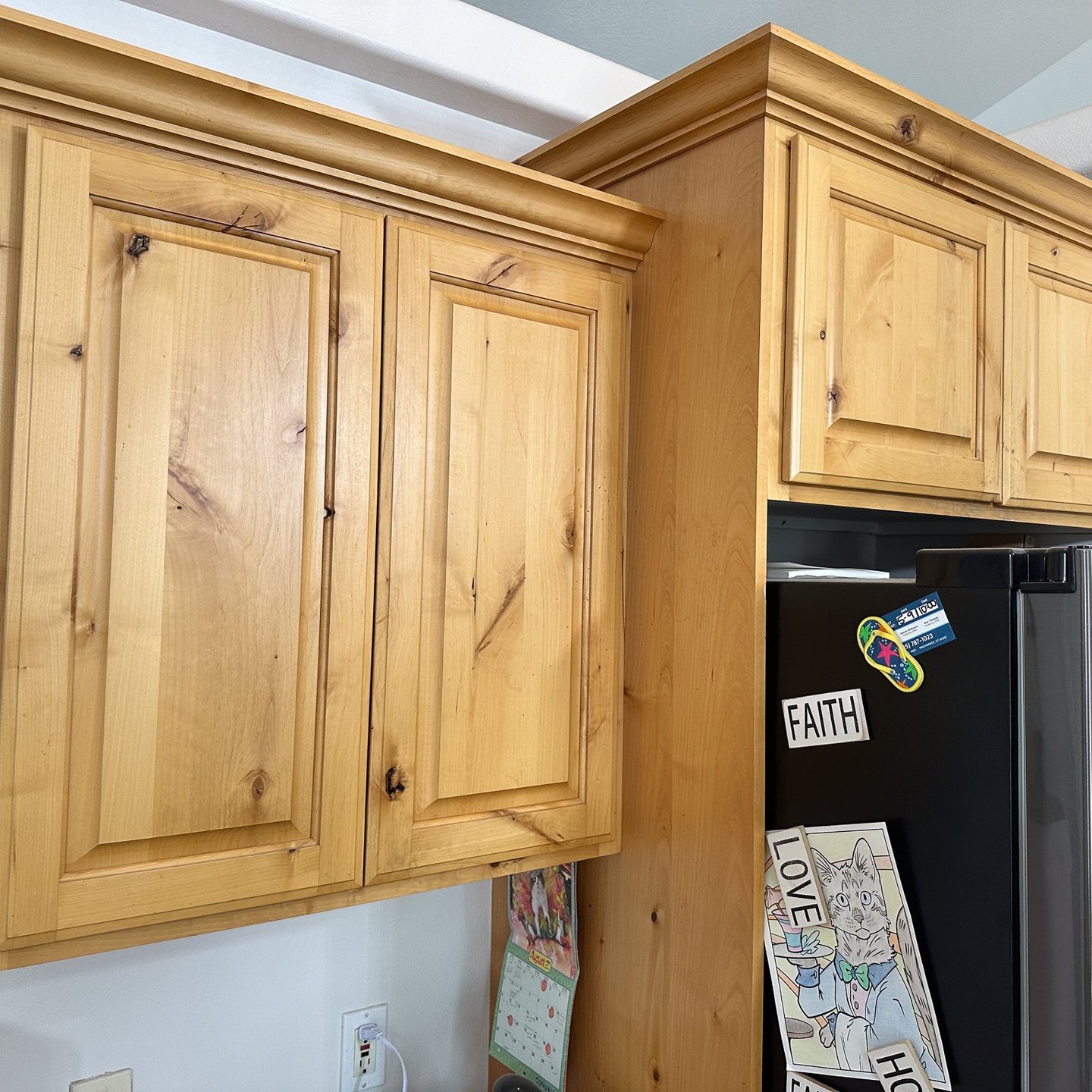 Light wood kitchen cabinets with a natural finish