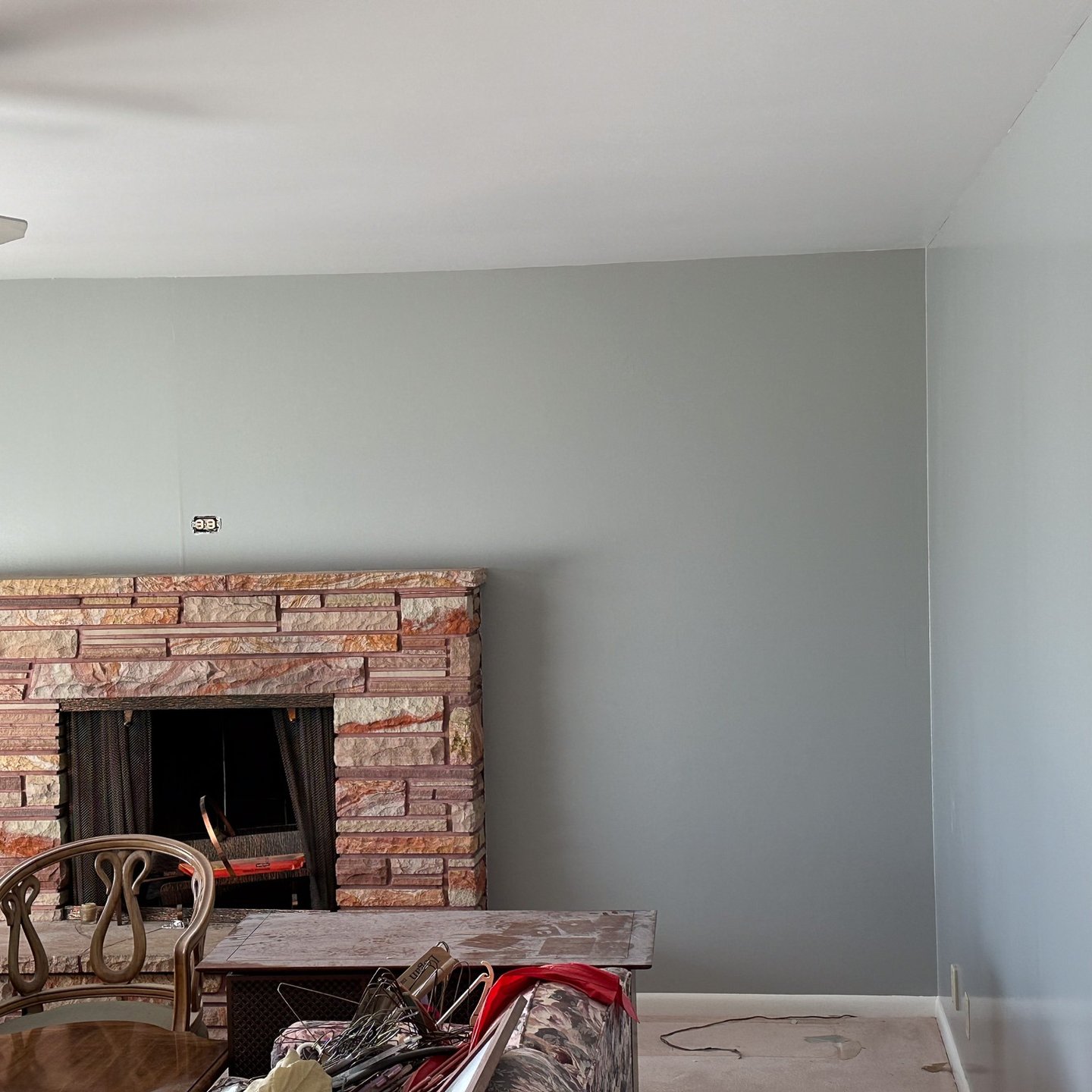 Fresh painted wall around a brick fireplace