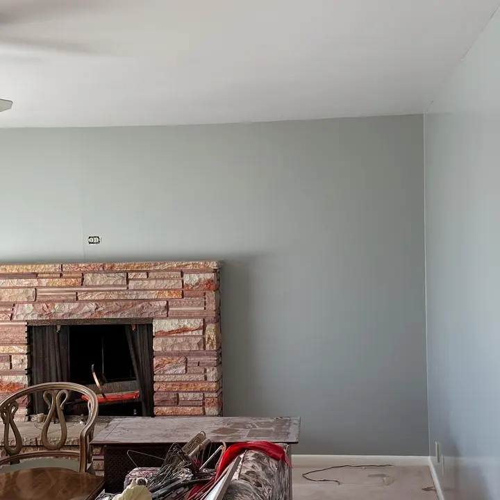 Painted wall around a brick fireplace