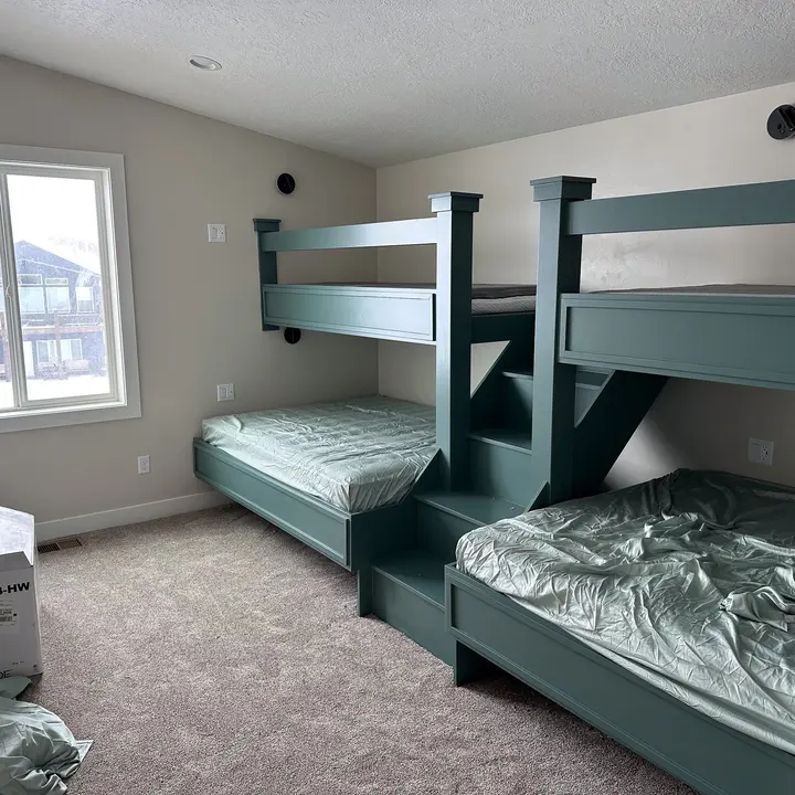 Painted bunk bed frame in a finished room